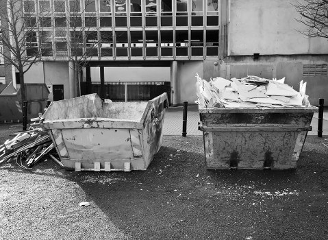 Mid-sized project site with a rented skip