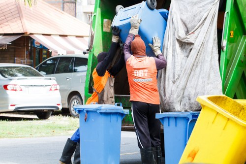 Workers sorting recyclables at a local transfer station
